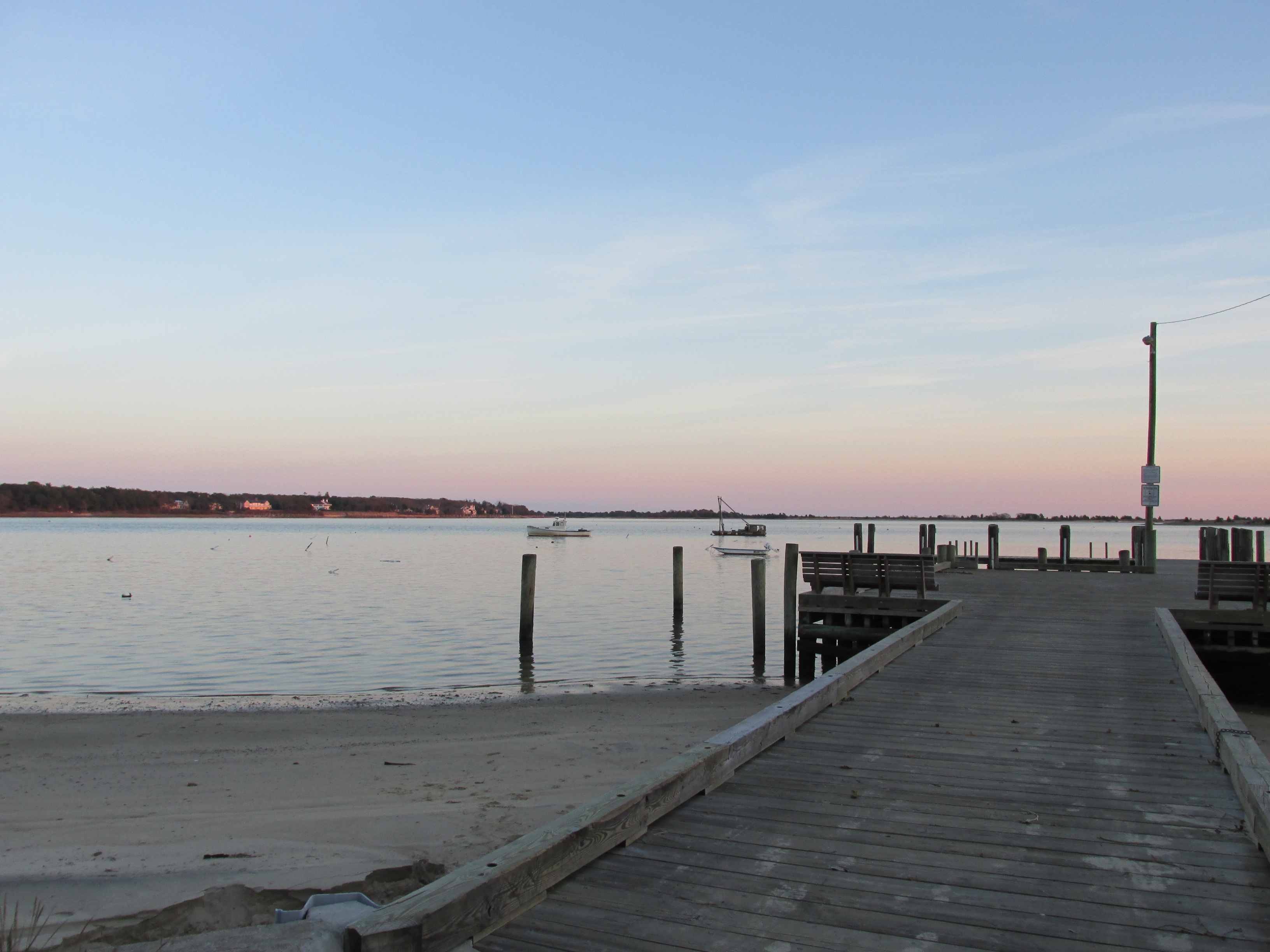 Cotuit Town Dock with water and small boats